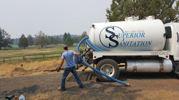 Backing up the truck to the located septic tank