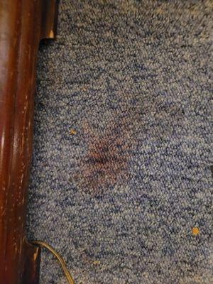 Blood stain on carpet and it wasn't cleaned before giving room out