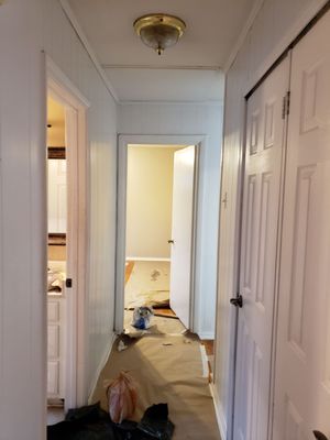 Hall way with  a doors both  side with a great  white alabaster  interior  paint from sherwin  Williams