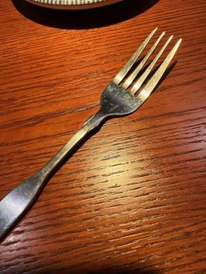 Dried dirty food on fork