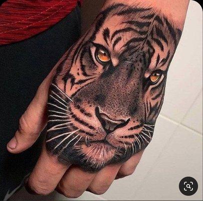 Tiger face fist tattoo !!