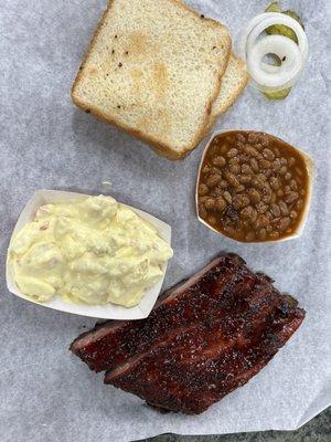 Rib plate with potato salad and brisket baked beans sides!