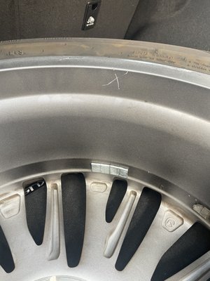 "X" gouged into new aluminum wheel