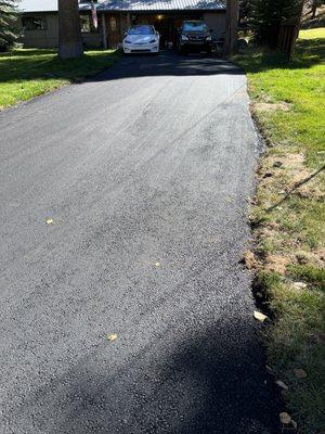 This side is the disaster of overgrowth and uneven since I bought the house years back.  Straight lines with a nice thick amount of asphalt!