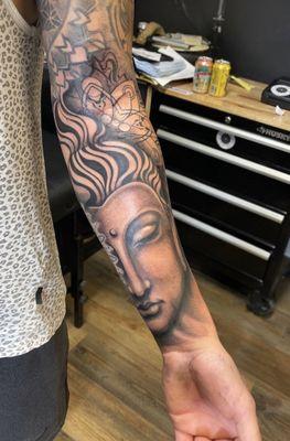 Buddha/sacred geo tattoo on forearm