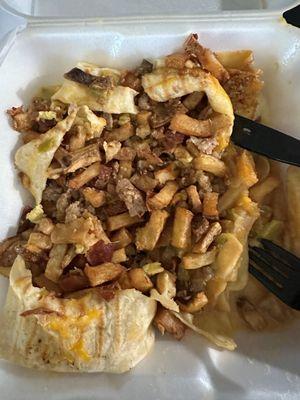 Breakfast burrito with barely any eggs and day old french fries.