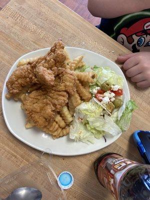 Chicken fingers and fries with salad