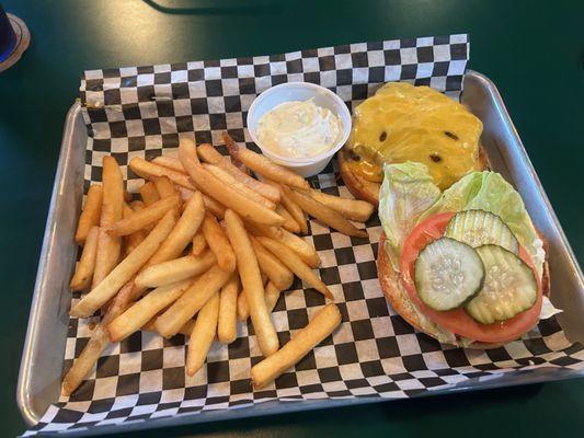 Cheeseburger with a not so generous portion of fries.