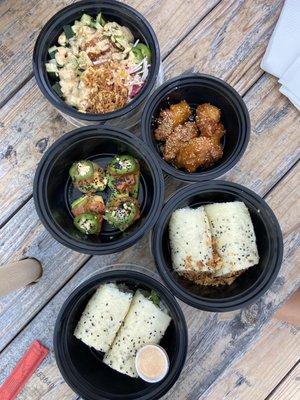 Poke bowl, wings, spicy daiko, crab sushi burrito & tuna sushi burrito