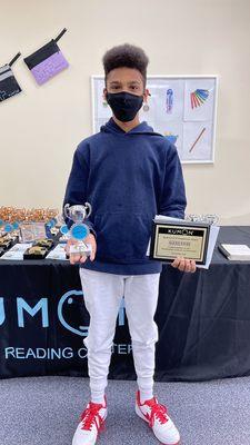 Alexis Favre (9th grader) receiving his silver award from Kumon