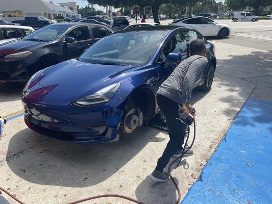 My Tesla getting a flat fixed