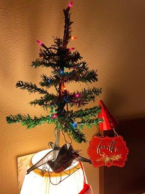 Sweet small tree, lights, sleigh ornament and Christmasy Faith on a board/placard.