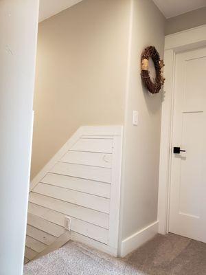 Top of the stair view after Dave worked his magic on our tiny upstairs hallway.