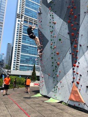 Auto belay with a city backdrop