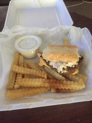 One half of the lotta burger with crinkle fries and one cup of the ranch