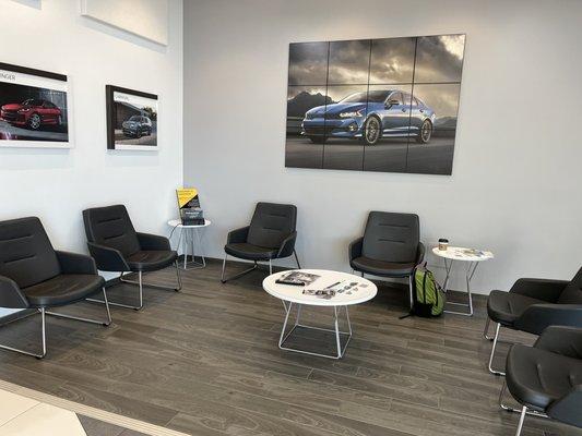 Service waiting area. A couple of phone charging plugs and a couple of outlets for laptops.