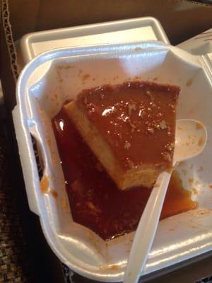 Flan that was delivered to my family tonight. Looks like the delivery driver was hungry. Spoon still in the container! GROSS!