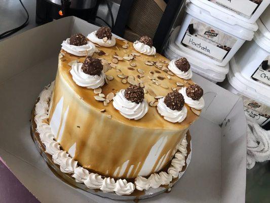 Chocolate cake filled with a Carmel buttercream, sliced almonds and Carmel sauce