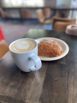 Caramel almond milk latte with chocolate croissant and cranberry scone