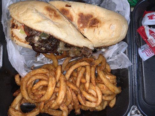 Philly cheesesteak with curly fries. Absolutely delicious!