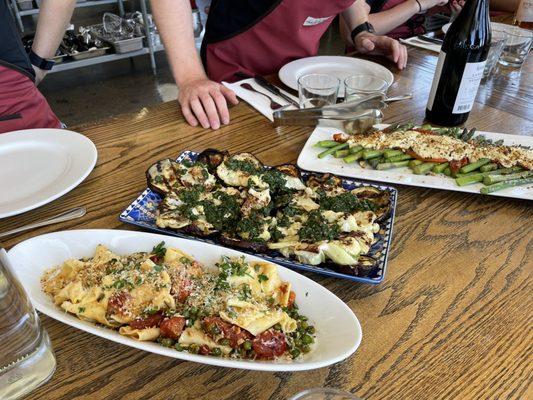 Handmade pappardelle pasta, cauliflower steaks with salsa verde, and chilled asparagus with roasted red bell peppers