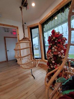 Wooden hanging seats by the window