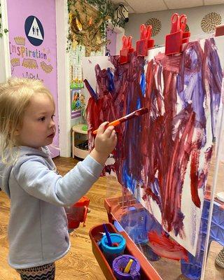 Aubree painting a masterpiece