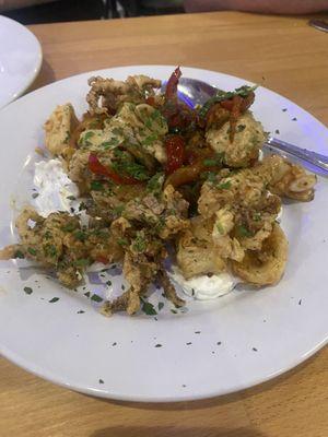 Fried Calamari over a yogurt blend.