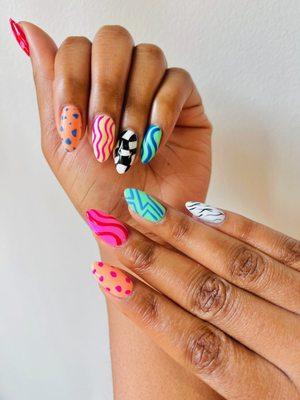 Groovy Gel-X nails. One of our favorite ways to design unique nails for our clients is to create custom designs on all 10 nails!