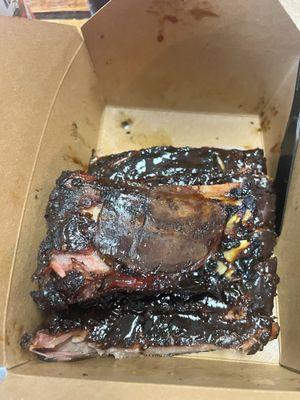 Full slab of ribs covered in sweet sauce.