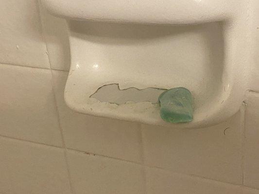 Peeling soap dish. Also not caused by us or shower mat