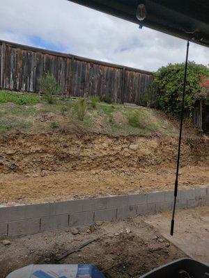 After excavation. Just gotta put a new retaining wall and it's Backyard BBQ time.