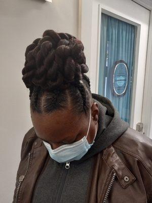 Big cornrows updo with twist