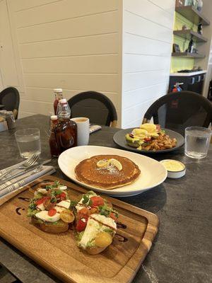 Avocado smash, side of one lemon ricotta pancake, La Jolla benedict