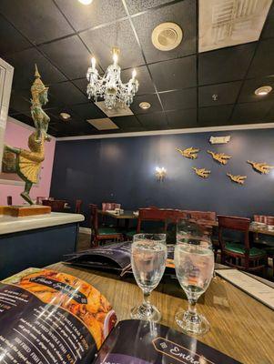 Inside the dining room, facing the bar and entrance area. This is one of a few different dining spaces they have in here. Spacious place.