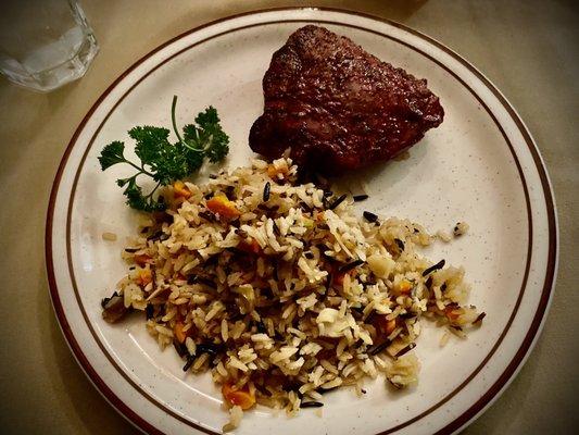 Ribeye with rice pilaf.