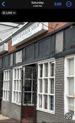 Pete's Barber Shop- gates closed, not locked, customers inside, 3:06pm Saturday