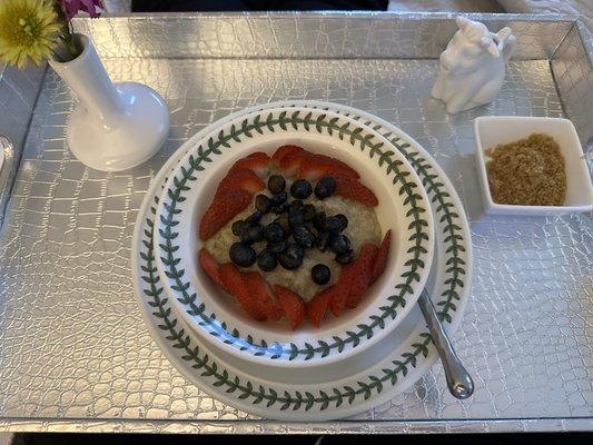 Delicious oatmeal with fruit, brown sugar, and almond milk in the cow.