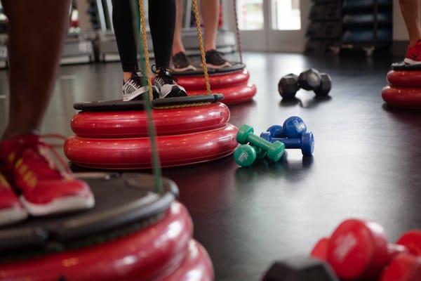 Floor equipment and exercises change daily (ex: dumbbells, bars, bands, medicine balls)