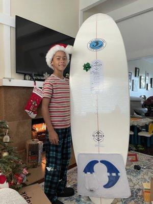 My son with his new surf board