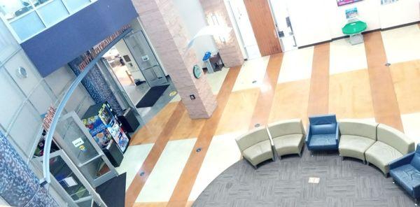 In the front entrance foyer with seating area that serves both the Utilities Exploration Center and the Riley Library.