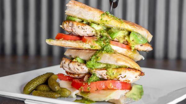 Burrata, Pesto, Tomatoes Panini - Tomatoes, basil pesto, burrata, arugula, olive oil, cracked salt and pepper, balsamic reduction.