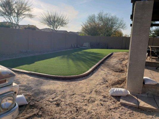 Final install of artificial grass with curbing.