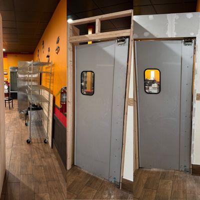 building a wall and moving a door in a restaurant