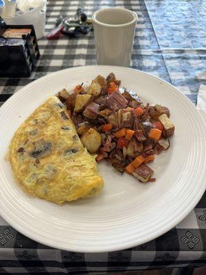 Mushroom and cheddar omelette with a side of brisket hash.