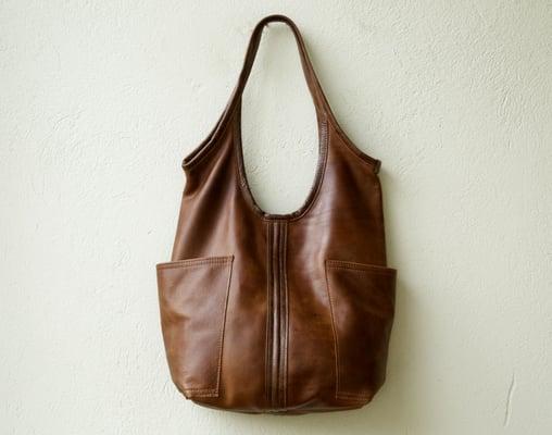 the Access Sling in vintage saddle leather