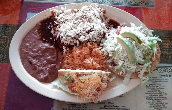 This platter I had between lunch and dinner was good and filling.  It was 3 items with rice and refried beans.