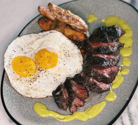 Steak & Eggs with Wanderer Bavette 10 oz, 2 fried eggs, crispy potatoes, aji amarillo at Pacific Standard Prime steakhouse in Redondo Beach