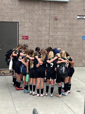 Here's my daughter's team coming together after playing their hearts out! It is an awesome league.