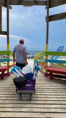 Walk across boardwalk into beach access